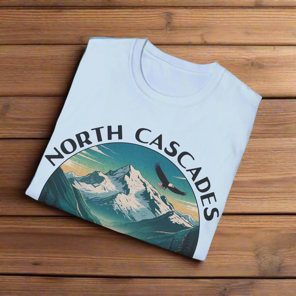 Light blue t-shirt with 'North Cascades' graphic design on a white background